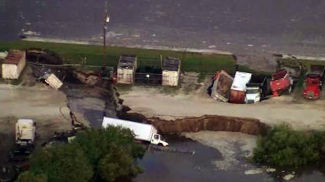 Security Officer Finds Massive Holes Swallowed Trucks Outside Florida Business