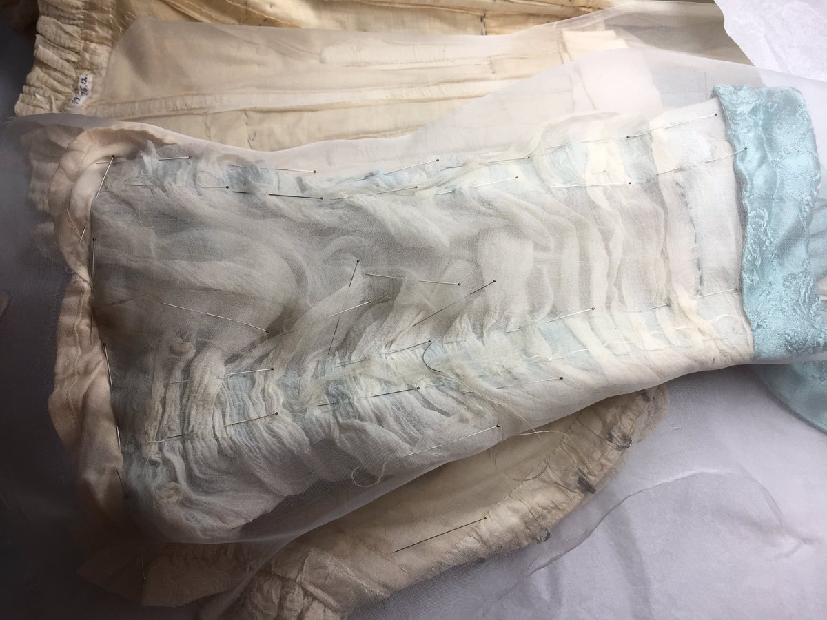 bowesconserves's tweet photo. Supporting the weak lining of the sleeves of the #Liberty dress @TullieHouse with a new lining of silk crepeline following the original stitching and providing extra support around the fragmentary pieces @TheBowesMuseum #trickyproblems https://t.co/K5054Yn562