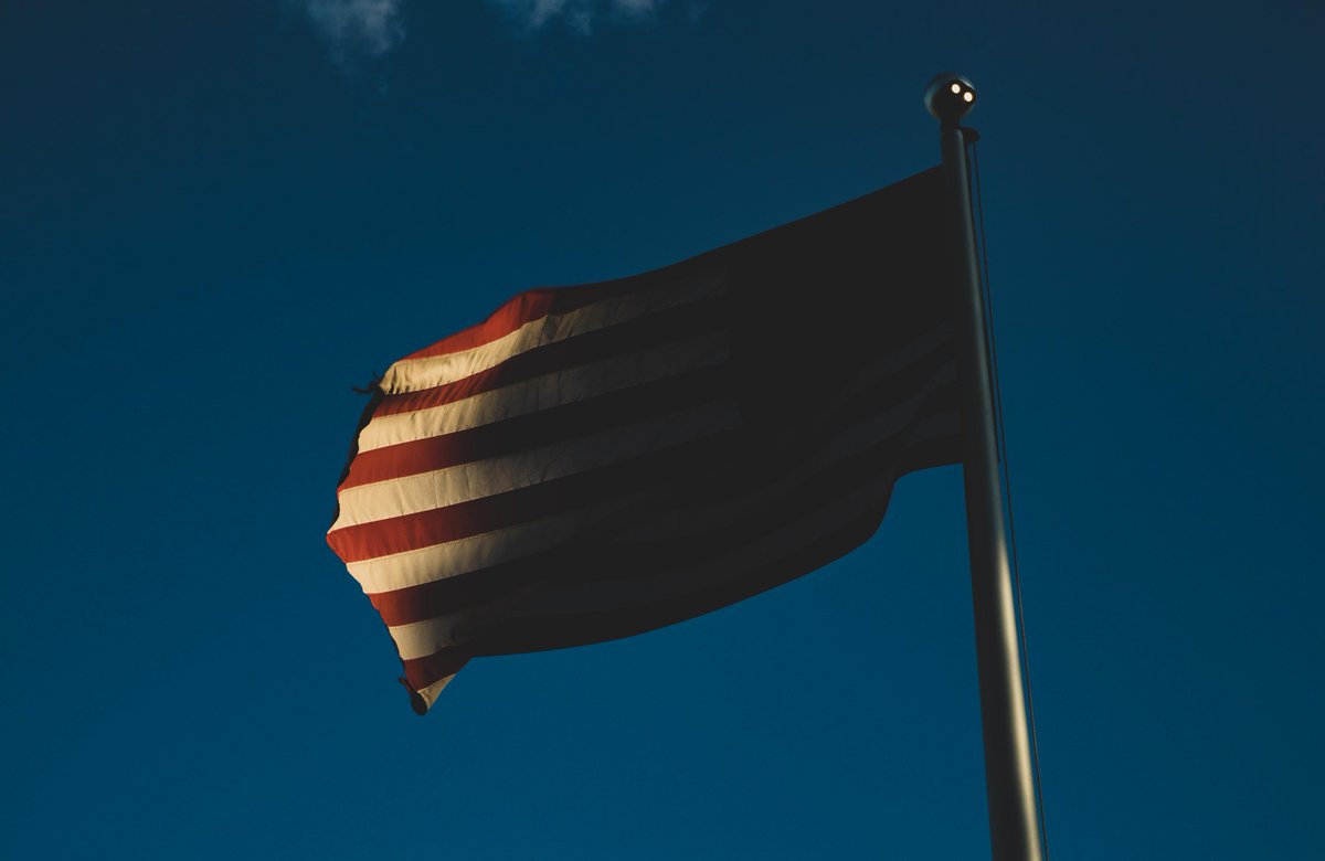 wildcatphotog's tweet image. The sun sets on #OldGlory and the @CATSAcademics Ginny Clements Center.