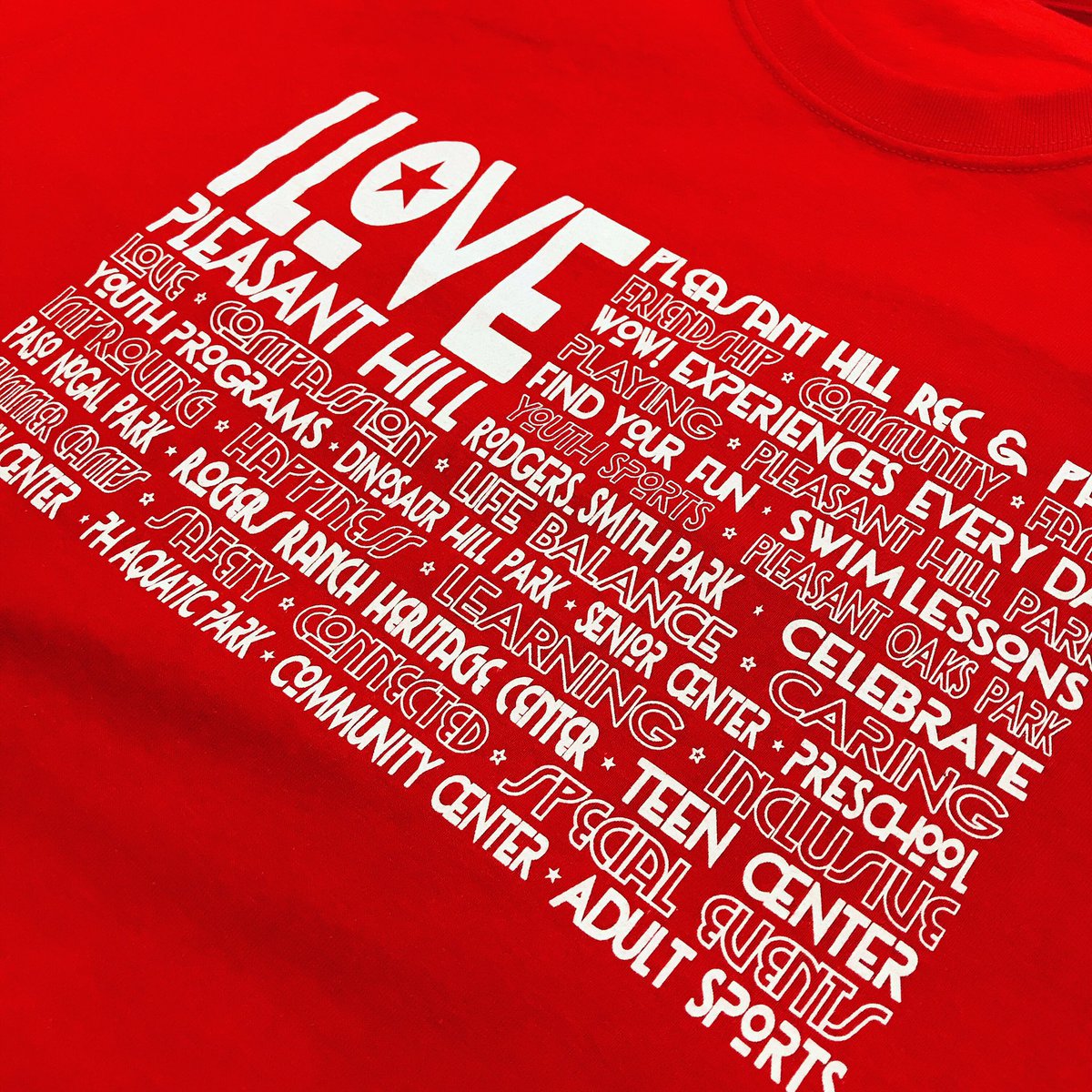 SpokenCloth's tweet image. Love these tees! They’re available @PleasantHillRec today! #Happy4th