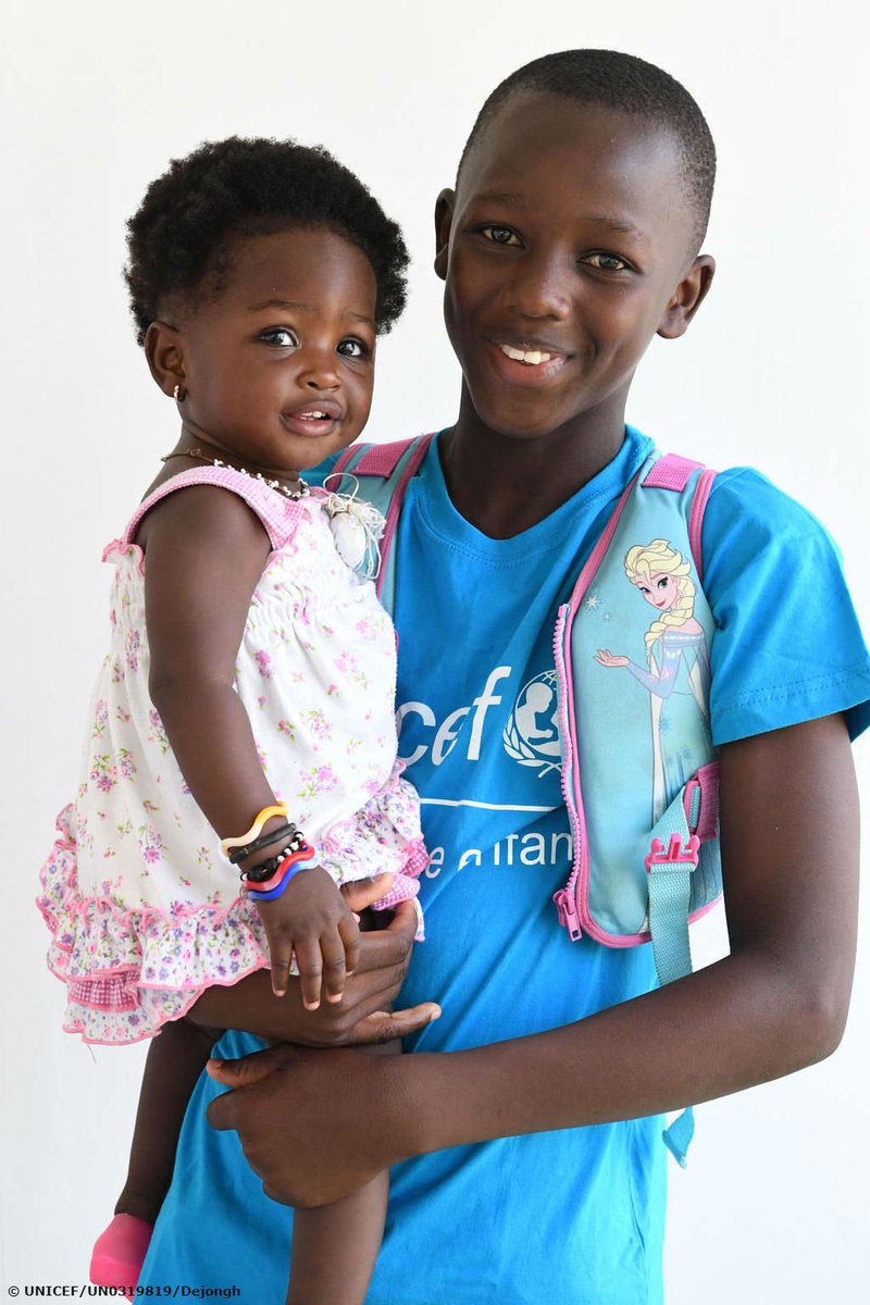 UNICEF's tweet photo. Abdul, 11, carried children to safety through sheets of rain and raging floods in Port Bouet, Côte d'Ivoire.

Here, he’s proudly holding his little sister after being honoured for bravery by @UNICEF_CIV.

#ForEveryChild, a hero. https://t.co/D4V0EKWfBN