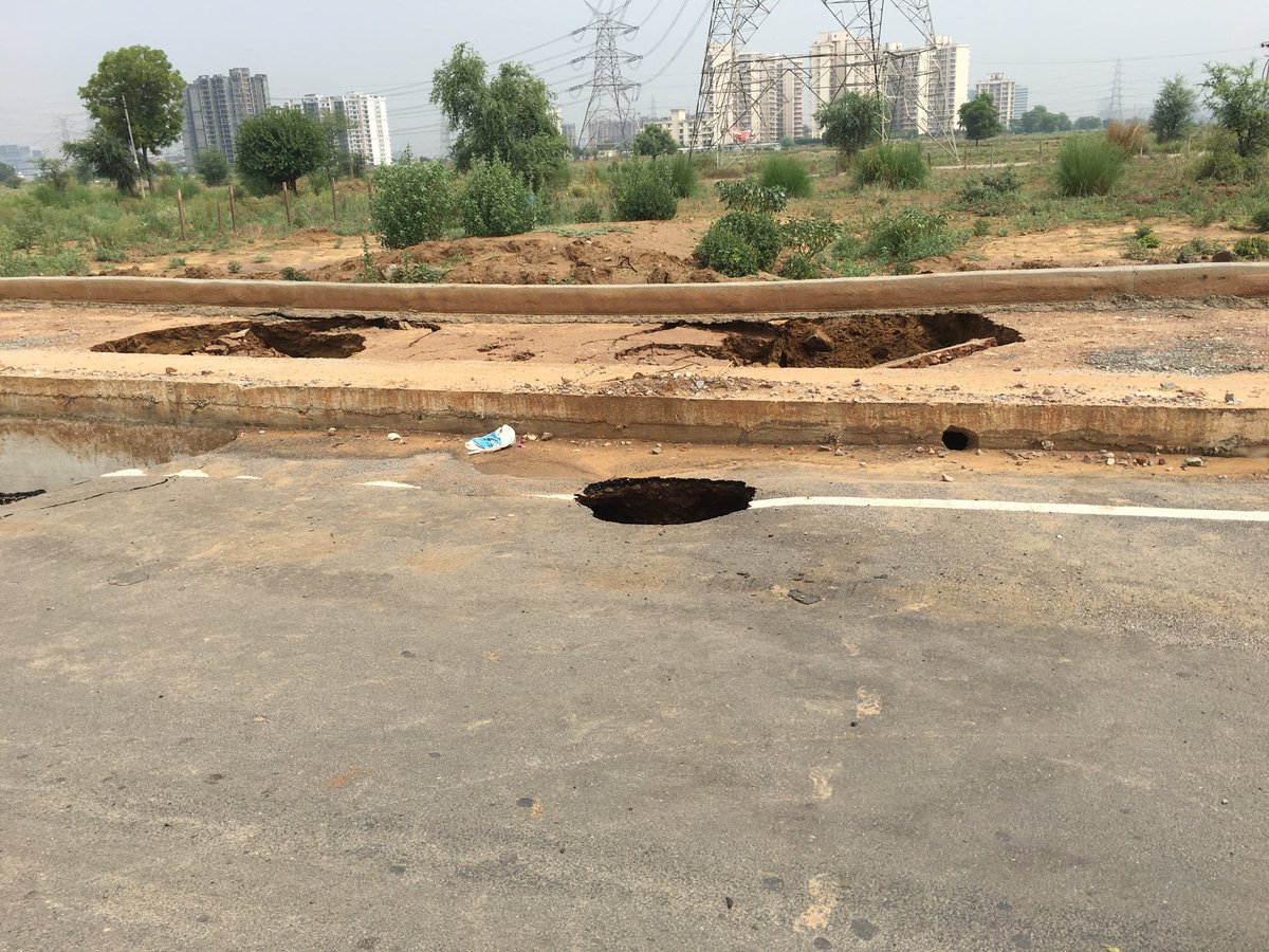 virenderd's tweet image. Road caved in both sides of the road after yesterday’s rain at Sector 70A, Gurugram ⁦@cmohry⁩ ⁦@DEEPAKKAHUJA⁩ ⁦@TrafficGGM⁩
