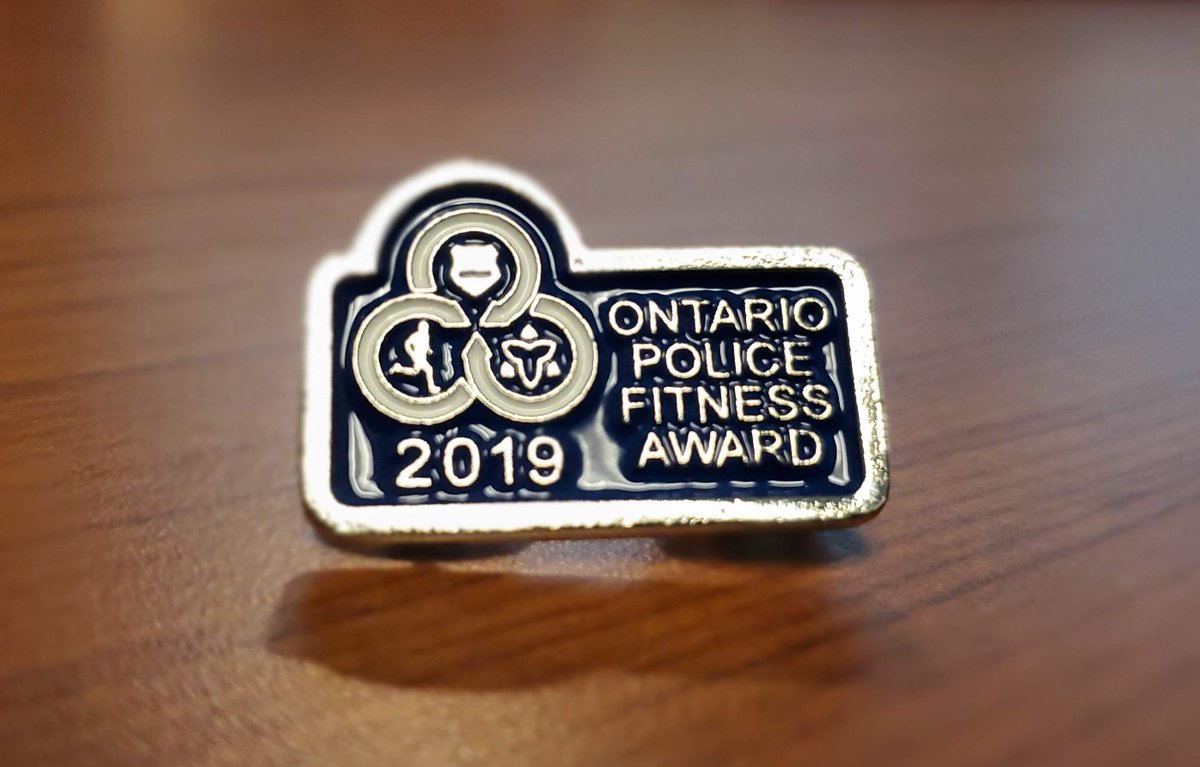 OPP_WR's tweet photo. Healthy body = healthy mind! Inspector Stu Bertram, Sgt. Beth Brown and Communications Operator Brad McDougal of the Provincial Communications Centre in London now have their shiny new 2019 Ontario Police Fitness Award. #SweatybutSmiling ^dr https://t.co/l4Zkrt9GF2
