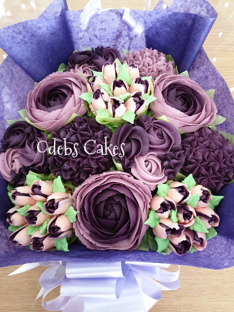 Roses, Hydrangeas, Tulips and Mini Swirls in Lilac and Purple....all hand piped and edible cupcake bouquet.