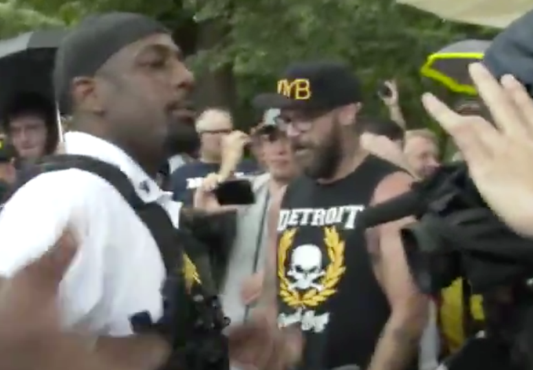 MCmuckraker's tweet photo. Here's a member of Proud Boys, a right-wing group that advocates political violence, wearing a Detroit T-shirt. Can you help identify him? His employer may want to know about his extremist beliefs. https://t.co/WzJbMlBXla