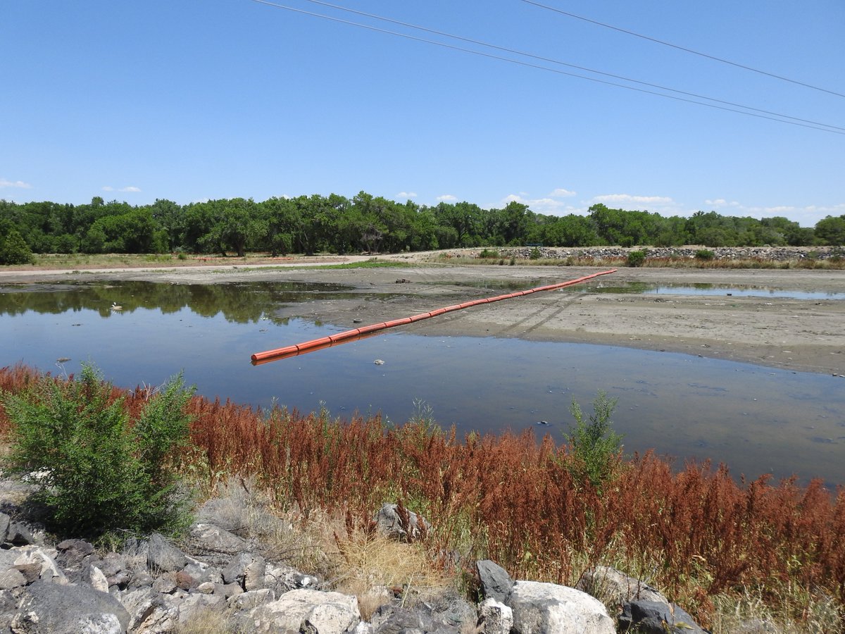 ABQFloodControl's tweet photo. July 5, 2019- #AMAFCA #FacilityFridays A recent addition to the North Diversion Channel outfall are some very large orange booms. These booms are put in place to catch floatable debris and help protect the maintenance road! https://t.co/iHkr19t6dv