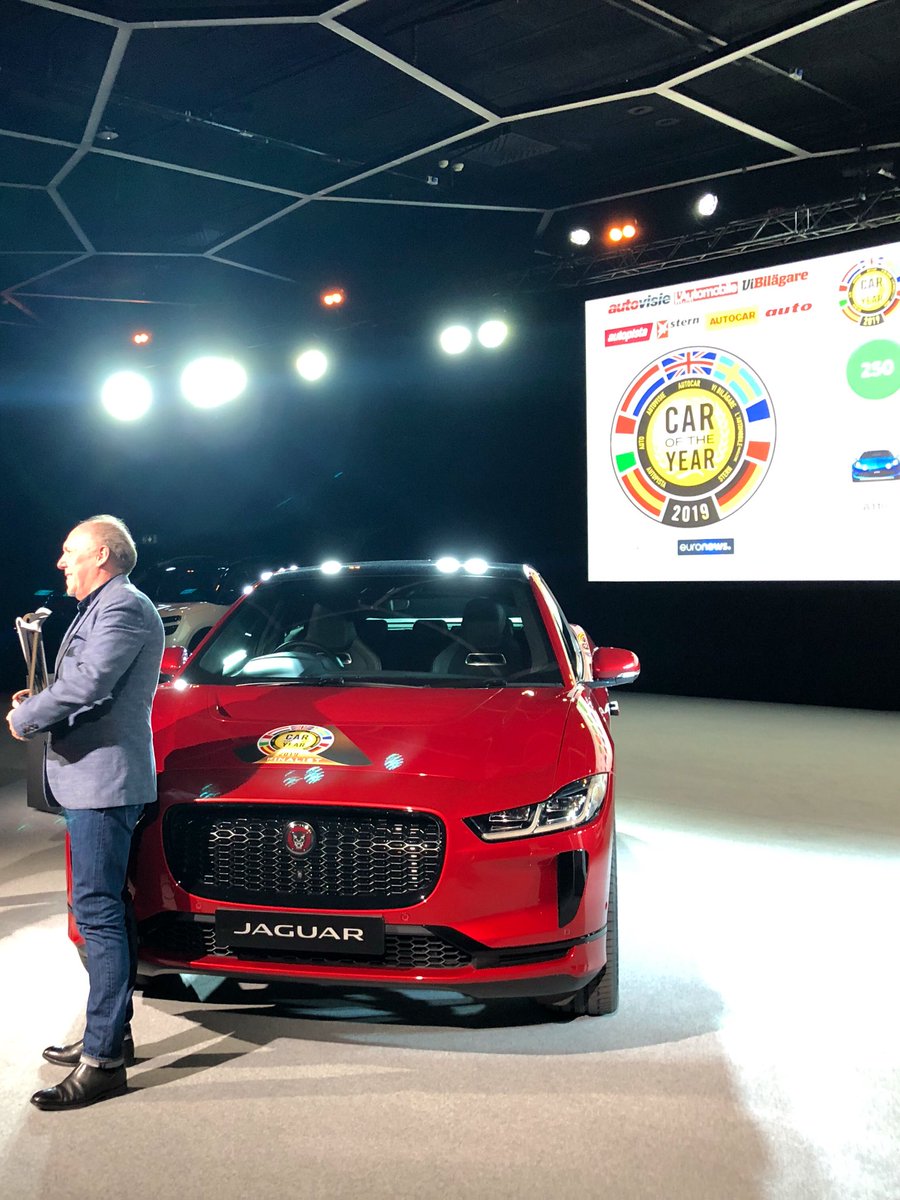 Ian Callum director of design of Jaguar receives the #CaroftheYear 2019 award from Frank Janssen president of the Coty Jury