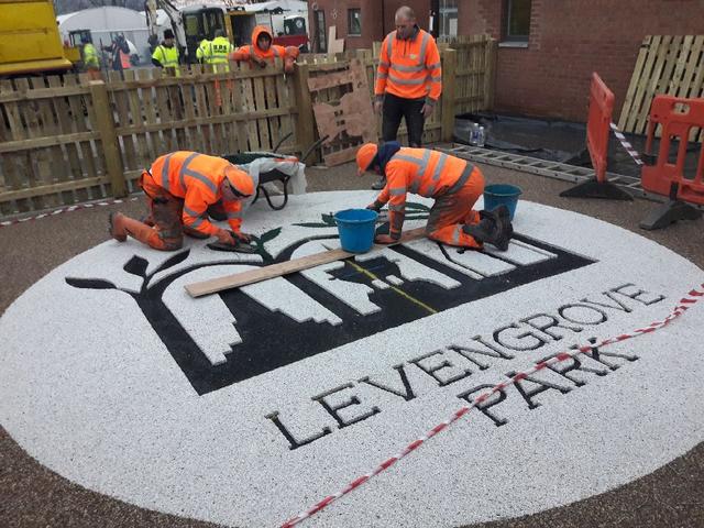 Covanburn's tweet photo. There are some things only Covanburn can do, and in Scotland you'll struggle to find anyone else to apply resin bound gravel as intricately this. Pictured are Andy Boyd Jr., Kyle Stevenson, Chick Reid and Cammy Ross. Thanks to @GevekoMarkingUK for supply of the unique colours. https://t.co/s8lx1yYydo