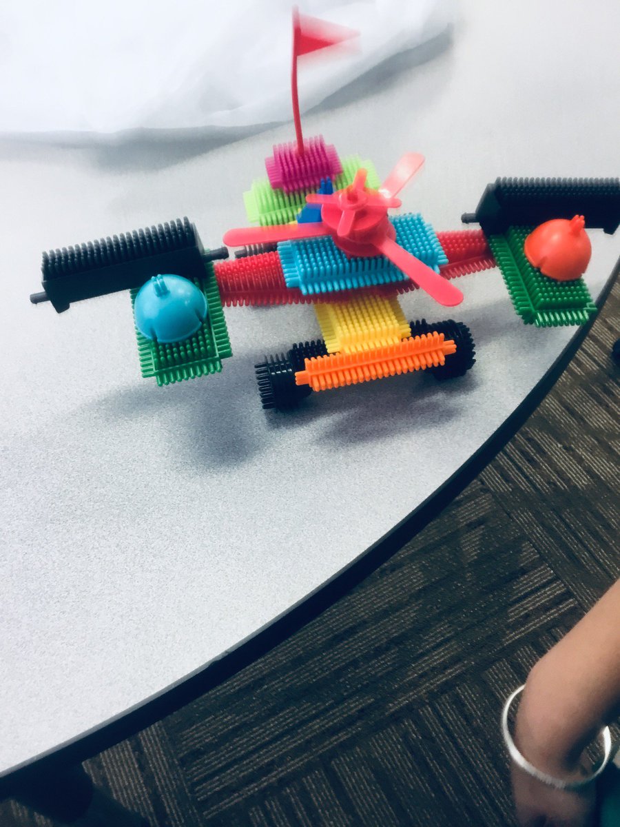 S, J and H made this car or you can call it a bat mobile colourful one we used blocks in order to make this car.