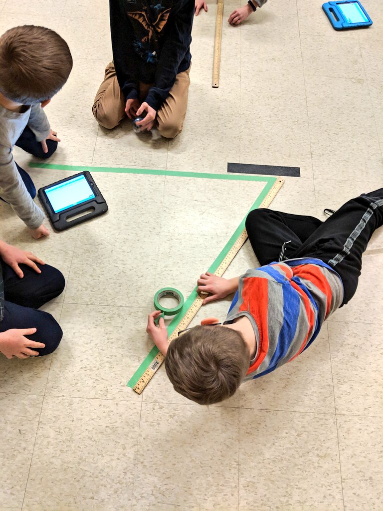 ScottMcKenzie27's tweet photo. @NewDundeePublic School Robotics Team working on this week's #MazeCraft challenge: Code 2 different triangles with a total perimeter of 4.5 meters. #WRDSBcodes https://t.co/7GG3h4CR5K