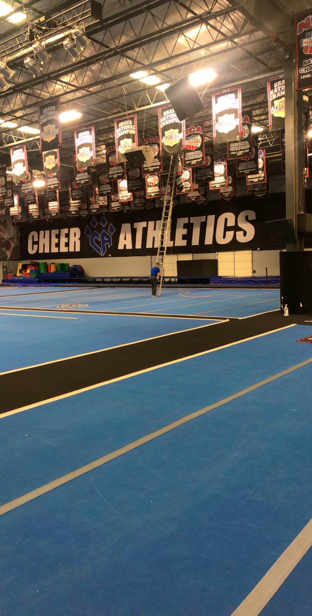 CheerAthletics's tweet photo. Just like that, our 16 newly crowned NCA NATIONAL CHAMPION banners are being hung up today! It was an amazing weekend! We CAn’t thank you enough @NCAupdates ❤️💙 https://t.co/3Zrfuwrntx