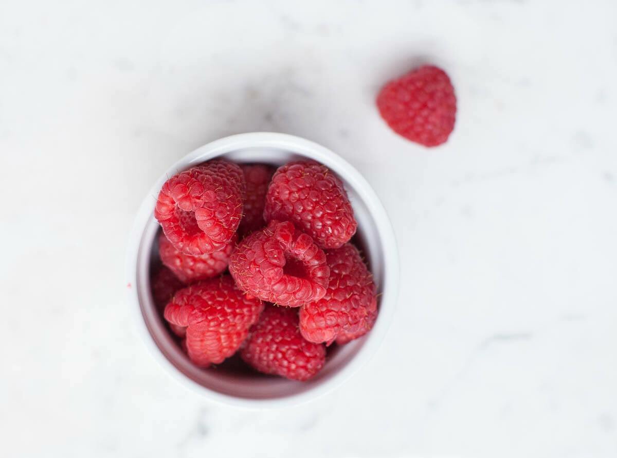 Giving Monday some raspberries.
