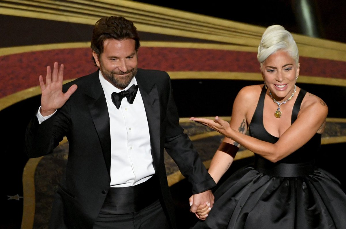 billboard's tweet photo. Fueled by #Oscars gains, @ladygaga & Bradley Cooper top the @billboardcharts as #Shallow surges to No. 1 on the #Hot100 https://t.co/gb59vgB2Xh https://t.co/IiZLIEIa1d