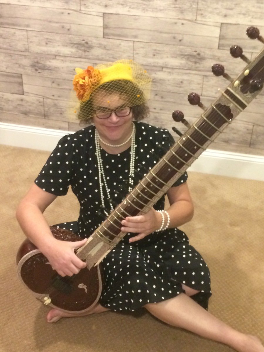 genderpunk360's tweet photo. A lady and a sitar.  #sitar #fashion #style #millinery 

https://t.co/PBJBoouJ7c https://t.co/eS7kS9zTl2
