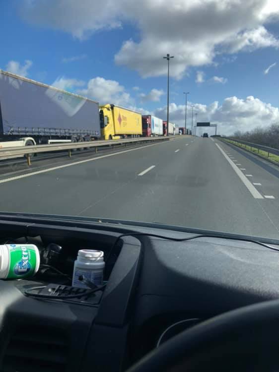 vanmaneuro's tweet photo. Yesterday French Customs at Calais implemented full border checks on all freight as a trial run in case of no deal. 
Today I passed over 20 miles of trucks queuing to get into the ferry port and Eurotunnel. Half of these trucks will have been European delivering into Britain 1/2 https://t.co/Gtv8nB7MaH