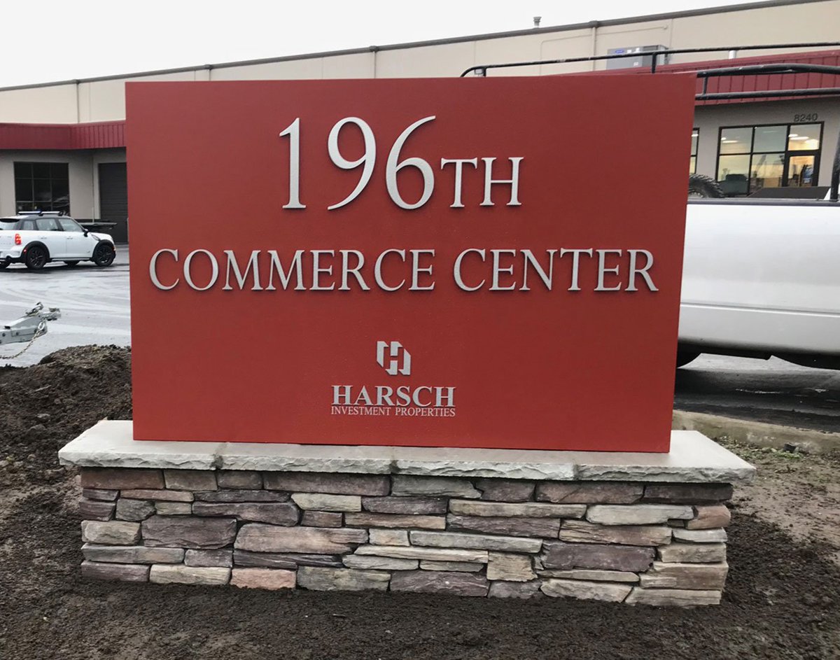 evergreensign's tweet photo. This monument sign project for 196th Commerce Center features an aluminum cabinet painted in a fire brick color with flat cut aluminum lettering in a brushed finish. The foundation exterior is finished in rustic ledge saddleback Eldorado Stone. #monumentsign #propertyID #aluminum https://t.co/9Xfnr3WQ6C