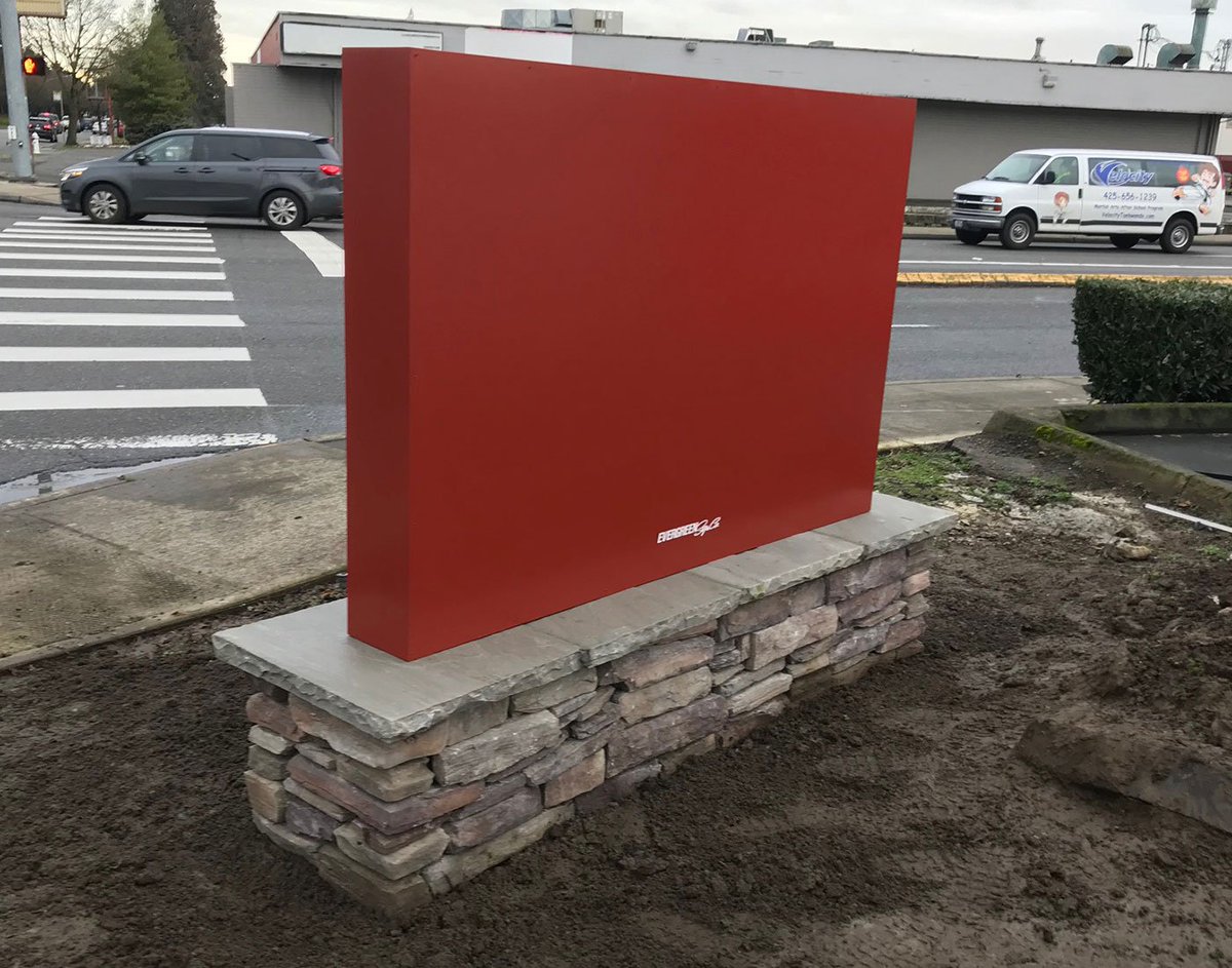 evergreensign's tweet photo. This monument sign project for 196th Commerce Center features an aluminum cabinet painted in a fire brick color with flat cut aluminum lettering in a brushed finish. The foundation exterior is finished in rustic ledge saddleback Eldorado Stone. #monumentsign #propertyID #aluminum https://t.co/9Xfnr3WQ6C