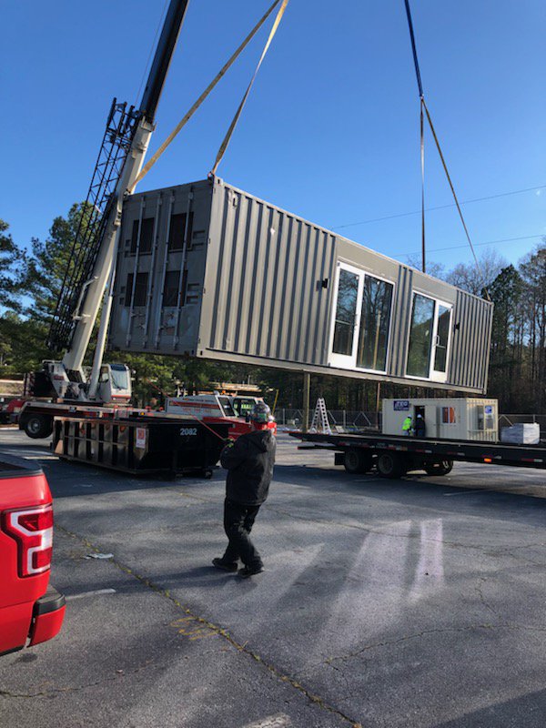 MARTAtransit's tweet photo. It’s an exciting day for @MARTASERVICE @MARTATOD1 and the @CityofAtlanta as we watch the @InvestAtlanta development team begin placing 12 shipping containers for the iVillage at H.E. Holmes. https://t.co/pmfVbPyaJy
