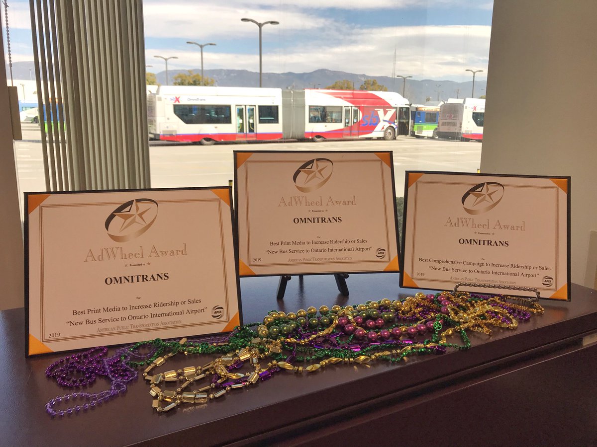 Omnitrans's tweet photo. Happy #MardiGras! We're the proud recipient of three #AdWheel Awards presented by @APTA_info at last week's Marketing &amp; Communications Workshop in #NewOrleans. We're honored to be recognized for our efforts to promote 15-min. service to travelers and employees at @flyONT. 🏆🏆🏆 https://t.co/4nEcVBInN1