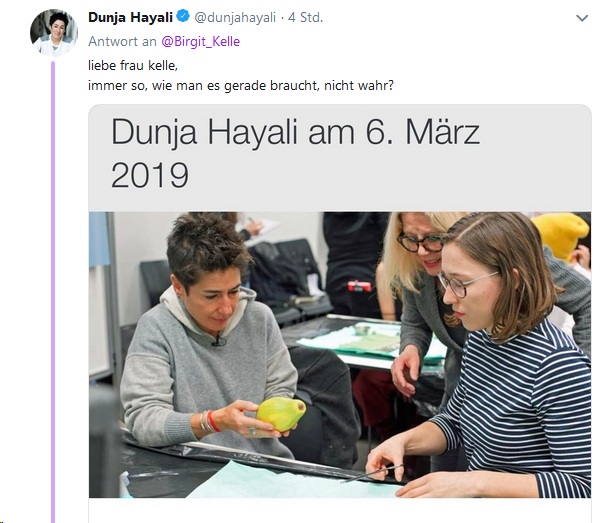 dushanwegner's tweet photo. Staatsfunk zeigt Foto von Haltungsjournalistin, wie sie sich fröhlich lachend (so sieht es aus) Zerkleinerung und Absaugung von Babies erklären lässt. Es wird ihr vorgehalten. Sie »verteidigt« sich und postet Foto, wie sie grimmig das Symbol einer Gebärmutter anstiert. #surreal https://t.co/ZlBTK7Bkij