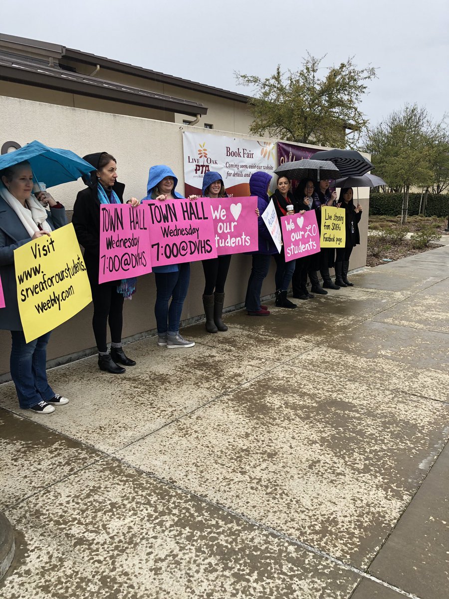 LOSRVEA's tweet photo. Standing in solidarity in the rain.. @SRVEA @SrveaPrez #forOurStudents #townhall #sanramonteachers https://t.co/vW6U3buEib