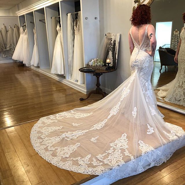 The train on this amazing @martinalianabridal style is out of this world! Throw in that low back, subtle sparkle, and a sassy plunging neckline and how could we not try it on?!