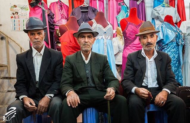 Iran_Style's tweet photo. 3 Haaj Agha Bazaari in their chapeaux posing in front of their colourful merchandise: women’s evening dresses in #TabrizBazaar, captured by #MehranCheraghChi. #fashion #photooftheday #photography #lifestyle #travel https://t.co/x0ipG1ljI6
