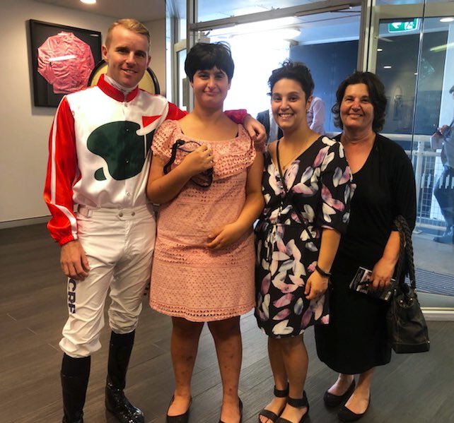 aus_turf_club's tweet photo. A visit to the Jockey’s Weigh-In room @royalrandwick today for Anthoula, a special needs strapper from QLD. 
Anthoula is very shy, but was overjoyed to meet @cwallerracing and also @TommyBerry21 who gave her signed goggles 💛 https://t.co/WIkPeirzHv