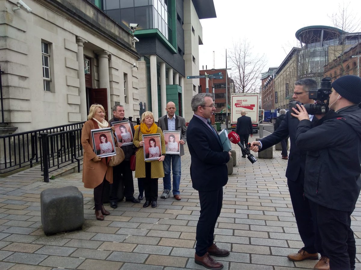 tftcampaign's tweet photo. The family of Jean Smyth-Campbell protest outside Belfast High Court regarding on-going judicial delay and police cover-up of Jean's murder by the British Army (which the British state then blamed on Republicans). Family legal rep @NiallOMurchu of @KinnearAndCo talks to the media https://t.co/3Hd6Wh3lAk