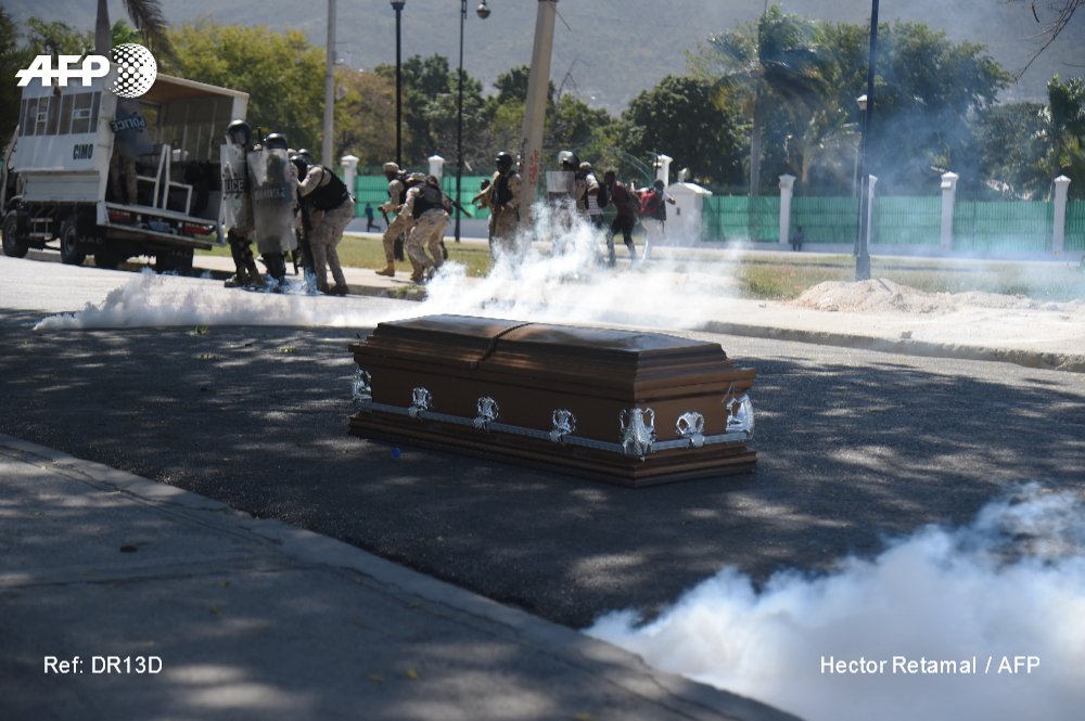 In Haiti, mourners for a man killed during demonstrations against President Jovenel Moise abandoned a coffin in the street when police fired tear gas, participants said