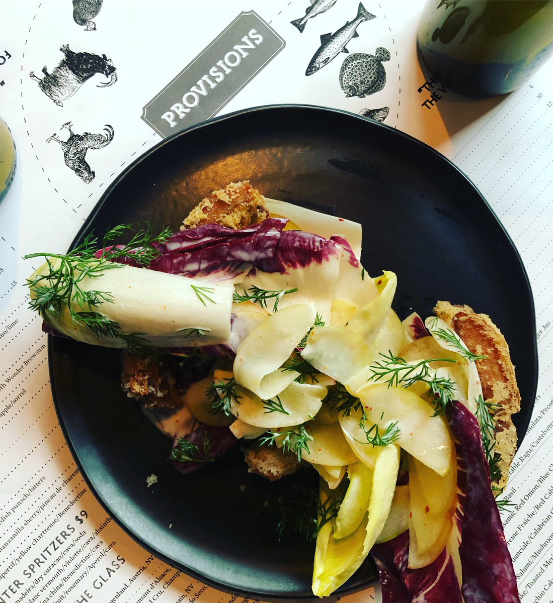 Crispy Pork ribs, chicory salad, and pickled honey crisp apples and asian pears. 
#gotexanday #provisions #eatlikeacowboy