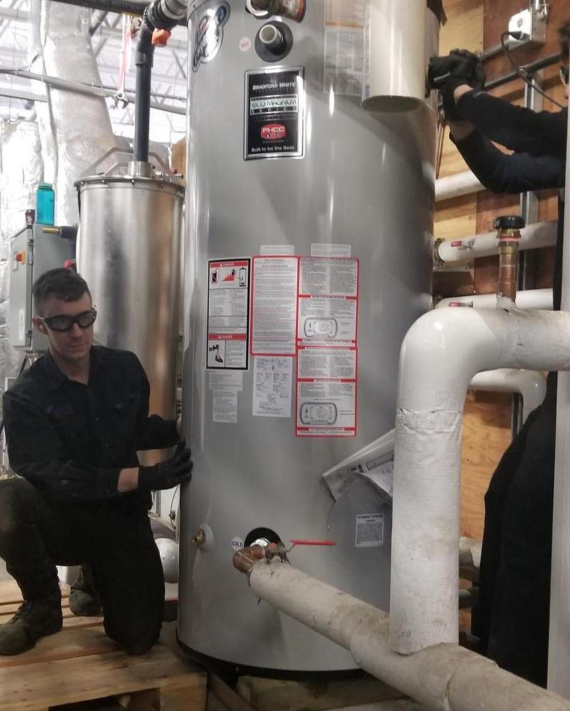 GWMech's tweet photo. Another successful Bradford hot water tank installed at Costco Edmonton this week. This one was only 18ft off the ground in the compressor room.  #SafteyFirst #NoTankTooBig #YEG #Alberta #plumbing https://t.co/4pXDF0UfGp