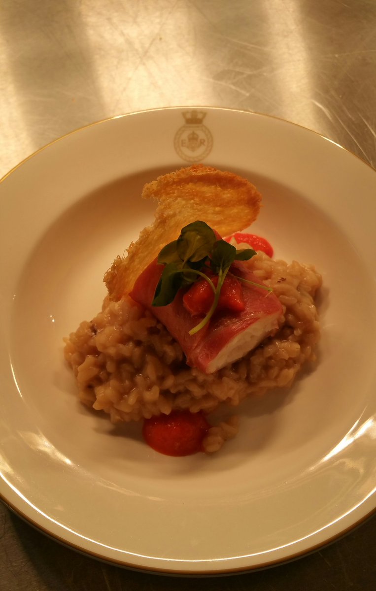 Prosciutto wrapped cod loin, mushroom risotto with a red pepper ketchup and Parmesan crisp.