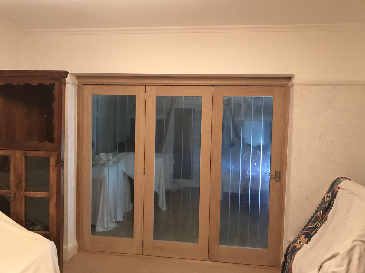 Oak doors fitted to act as a room divider between the living room and the conservatory. 

Doors fully open and stack on the same side allowing the rooms to become open all the way through. 

Client to decorate.
