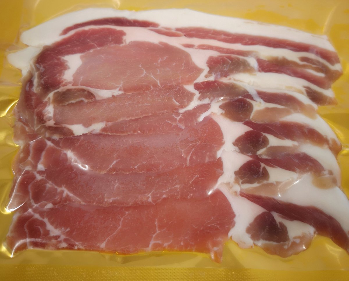 ClashSaddleback's tweet photo. Today's job - slicing and packing some beautiful sweet, dry cure bacon from our pedigree Saddleback pigs.  Doesn't come any better 😁 https://t.co/cHCYDHKhk1