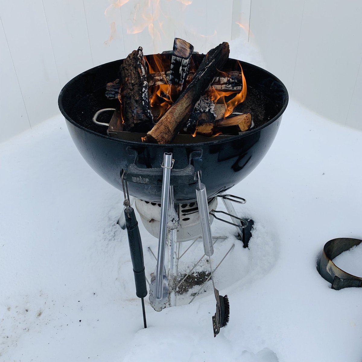 Trying to melt some snow, or maybe a nice bed of coals for a tri-tip