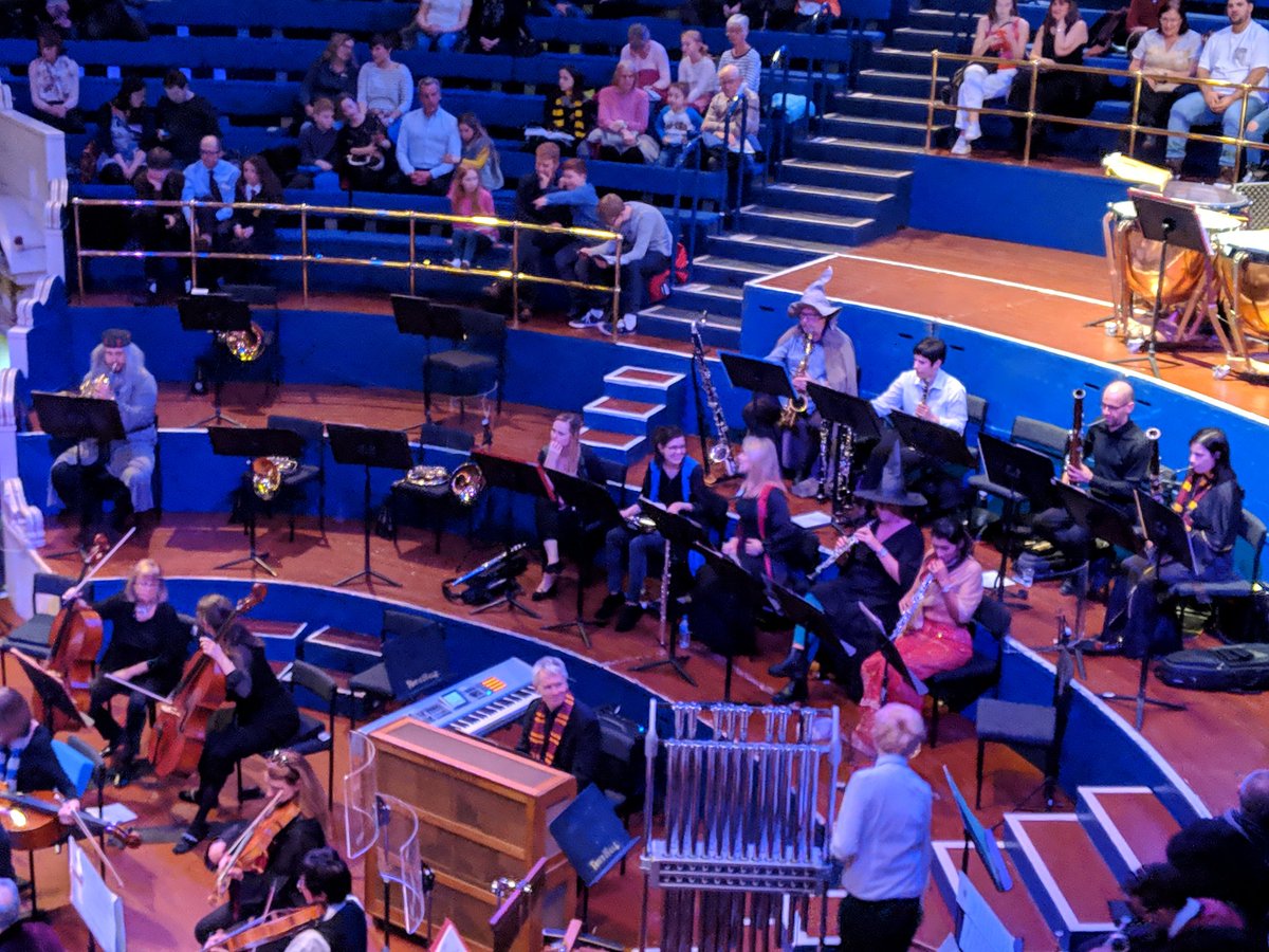 LeedsTownHall's tweet photo. The Hallé is taking over the Town Hall with music from all eight Harry Potter films. Don't they look great in their costumes on stage! Who can you spot? 😃⚡🦉 https://t.co/e0RQ7oysv8