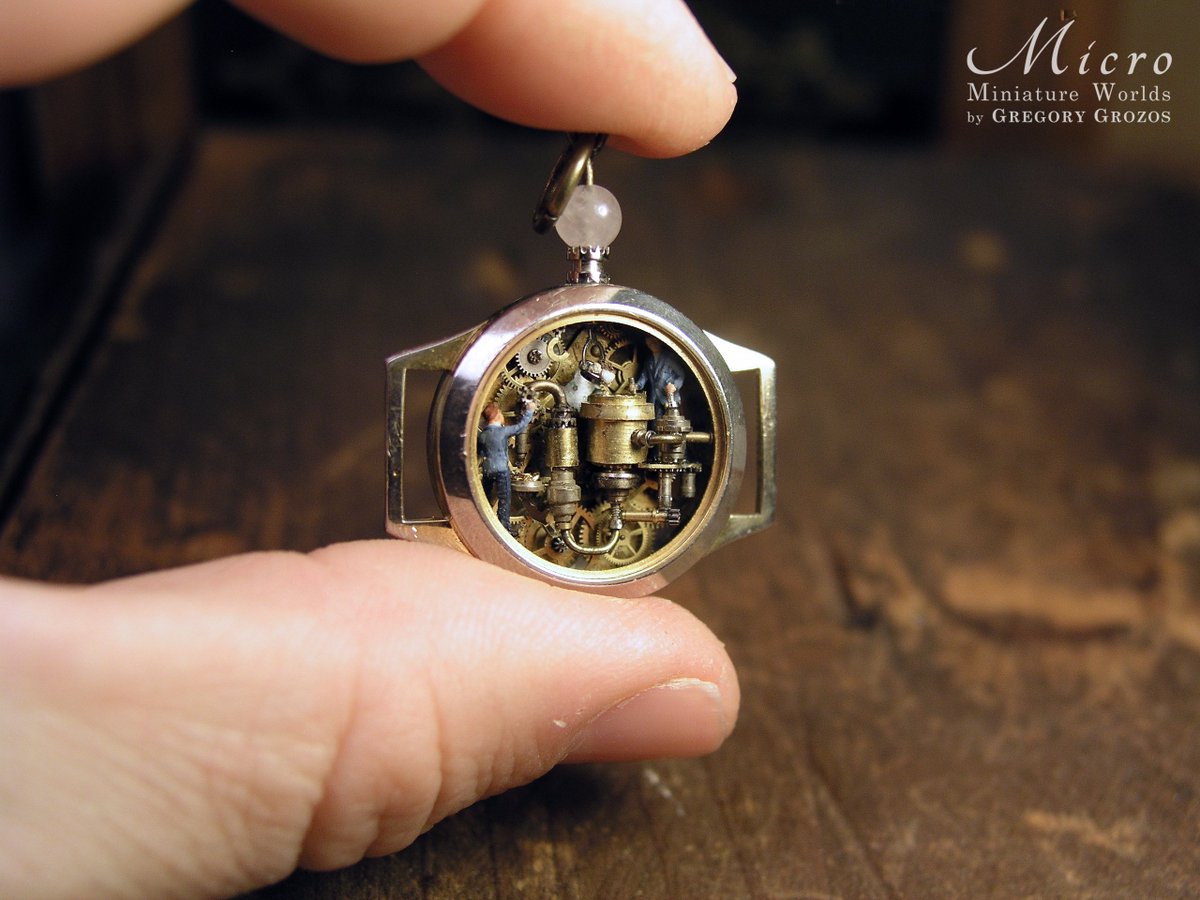 GregoryGrozos's tweet photo. My latest piece, a miniature factory which converts tiny pieces of stone  into gold. All the machinery has been made with tiny watch parts and  other metal bits and has been fitted inside a vintage watch case. Made  to be worn as a pendant. Enjoy!

https://t.co/f2wrq3ZeU5 https://t.co/WrIOlJ43ip