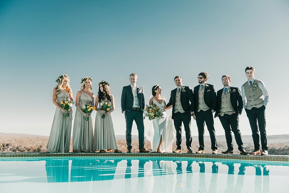SIMSieQ's tweet photo. Making the best men + bridesmaids stand on the edge of a cliff and infinityity pool for this shot #theylived #adventureisoutthere #capetownweddingphotographer https://t.co/e31FFUSlvx