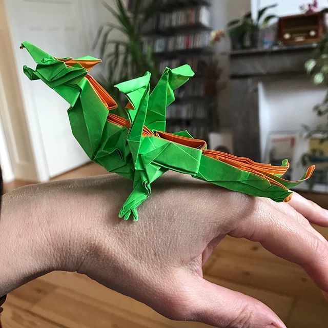 origamitraces's tweet photo. Fiery dragon v2 by Kade Chan Pak Hei. Deserves better paper. Kami 24x24) is not a good choice. Paper tears and is to thick. But hey, it’s still a dragon🐉 #origamitraces #origami #kadechan #fierydragonv2 
#dragon https://t.co/sqBsyArJpb https://t.co/d9w6MxR4Yz