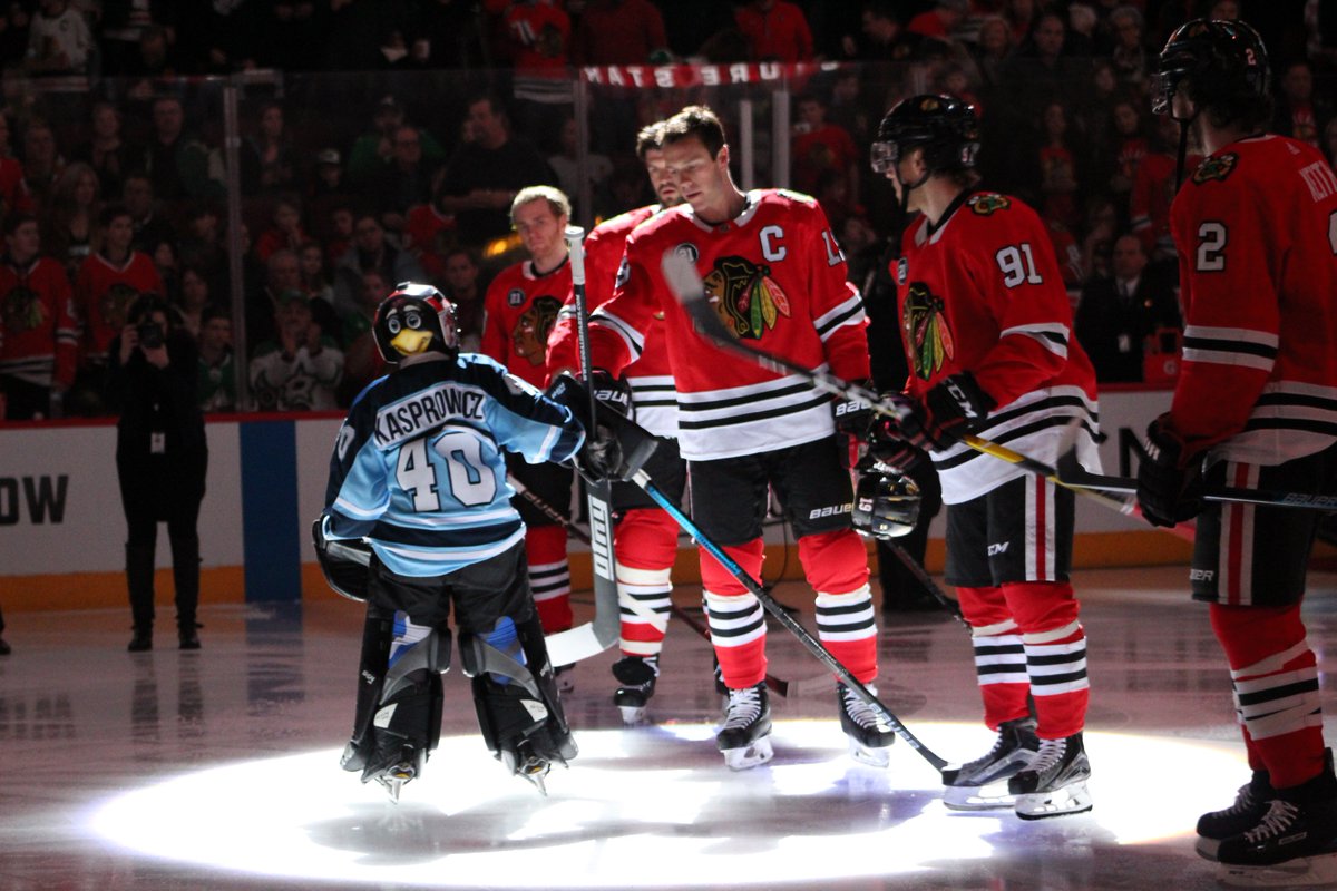 NHLBlackhawks's tweet photo. A pretty special place to stand for the anthem, right Edward?

#Blackhawks https://t.co/KRS8yb0N2A