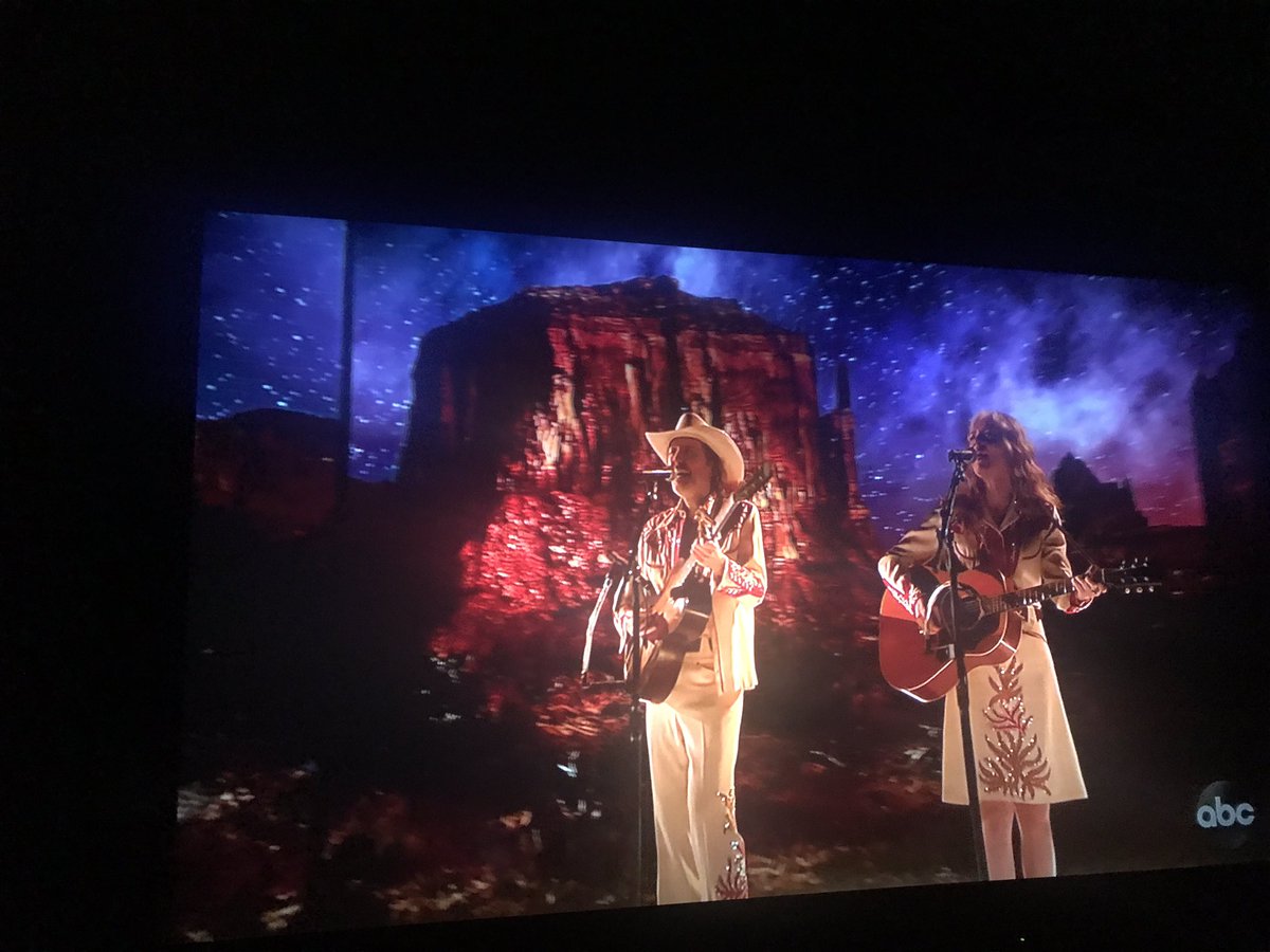 tonibirdsong's tweet photo. Show stopper: Best stage set of the night at #Oscars2019 for the song “When A Cowboy Trades His Spurs For Wings” from film ‘Ballad of Buster Scruggs.’ Absolutely mesmerizing desert theme. Another great stage #design by @trikecreative Performed by: David Rawlings &amp; Gillian Welch https://t.co/imOeKfPZuJ