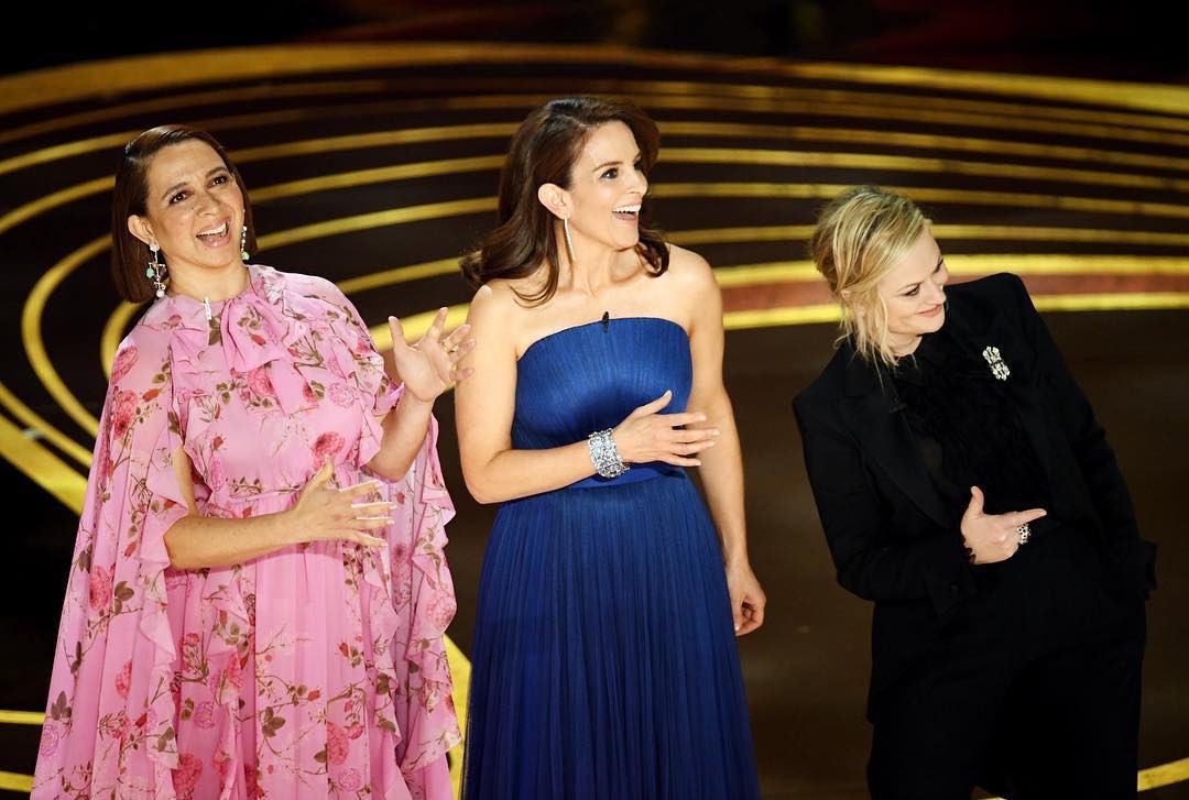 A photo of Maya Rudolph, Tina Fey and Amy Poehler on stage at the 2019 Oscars.