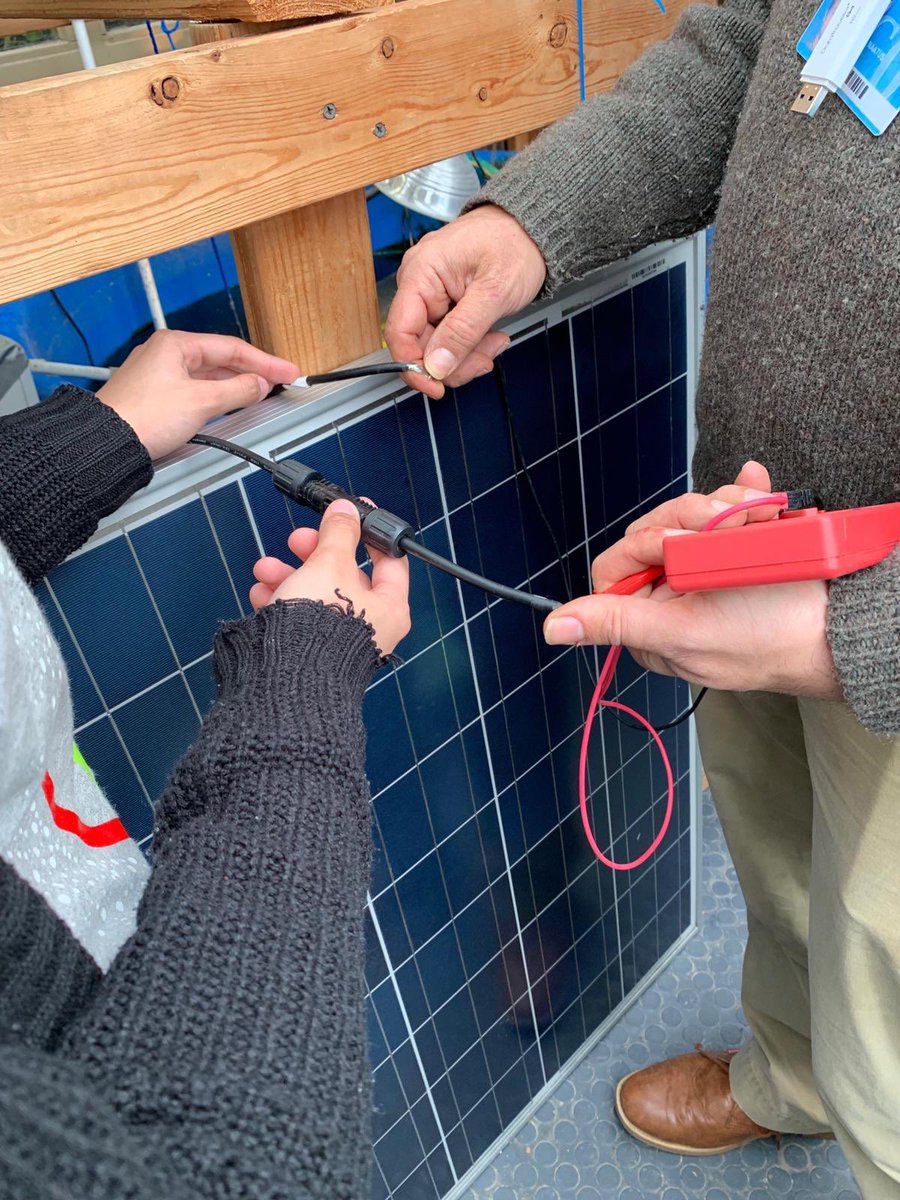 co2apt's tweet photo. Learning how to connect our prototype's fan to its solar panel, charge controller, and motion detector with one of our mentors, Mr. Naatus. @projectres #airfiltration #projectreservoir #airpurification #almostdone #co2apt https://t.co/CpT93myVs0