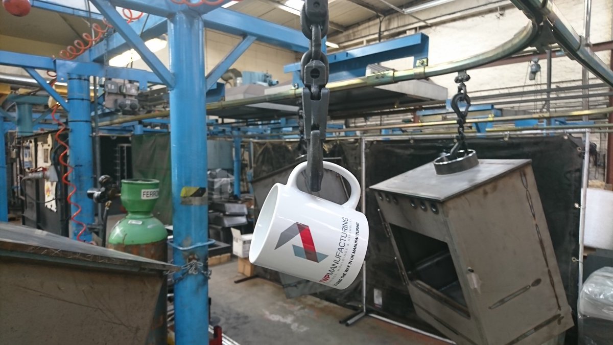 burleyfires's tweet photo. Good morning @threewaypress. A bit of #MondayMotivation with a picture of our TWP mug moving its way around our factory's overhead handling system. Currently at the #linishing stage of the stove production line. Off to #shotblasting &amp; painting #Manufacturing #GBmfg #UKmfg #SMEUK https://t.co/F8OyiX6P2N
