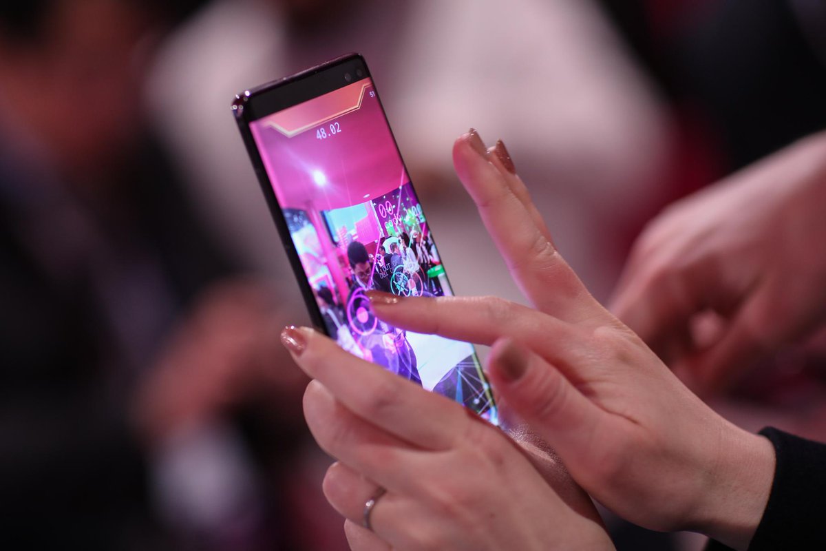 NianticSpatial's tweet photo. Our first #multiplayerAR experience, #CodenameNEON, is like dodgeball. Collect glowing energy orbs and throw them at your friends to win. Looks like our guests are having fun! #MWC19 https://t.co/d43lf9k60g