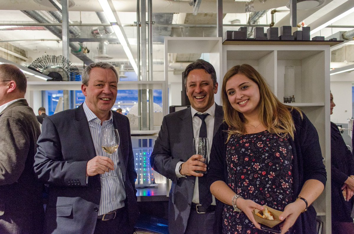 John McManus of BDP with Richard Witt and Giulia Barletta of Quadrangle, holding drinks and hor d'oeuvres