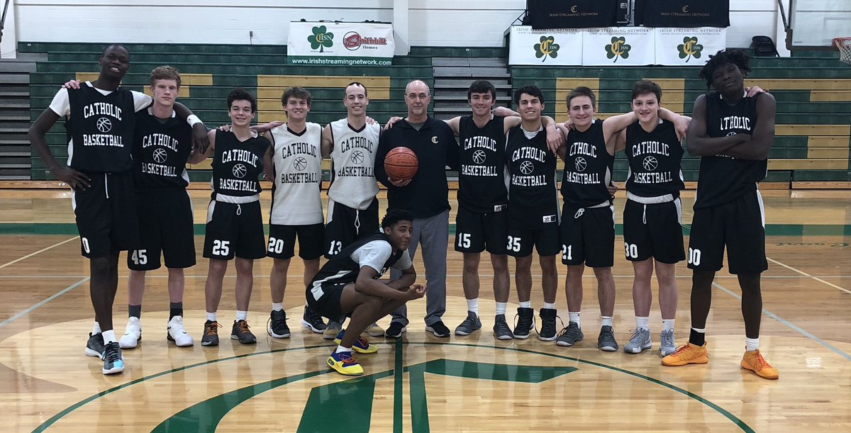 Team photo celebrating Coach Hutchens 550th career victory ☘️