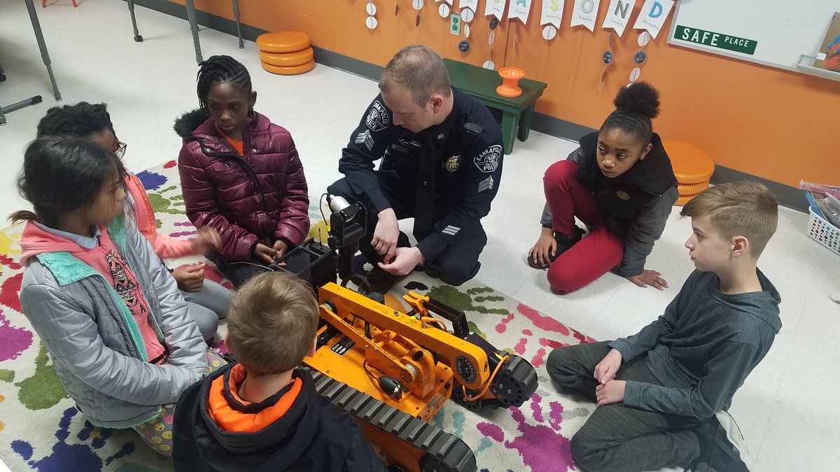TeamDurand4's tweet photo. We are so grateful to have had these two officers come and support our VEX Robotics teams! We learned just how impactful robotics is to our everyday lives and the lives of our community! @TeamDurand4 @#EngagecreateSOAR @kannapolis911 #WestandRowland #CommunitySupport https://t.co/pW2AkA9fgz