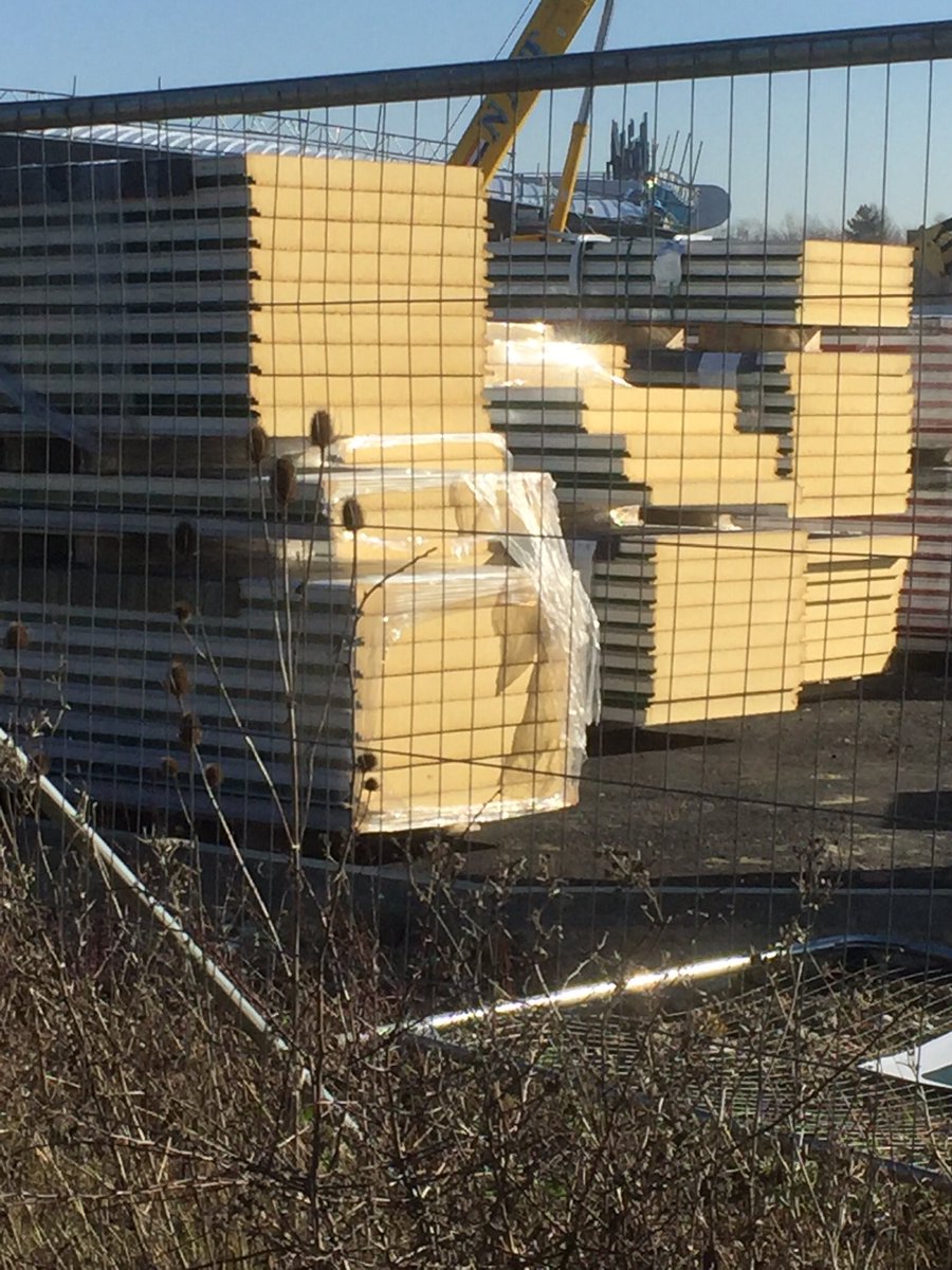 A little surprising to see the new Milton Keynes fire station (Blue Light Hub) being constructed with PU foam filled sandwich panels. 
Great example being set!